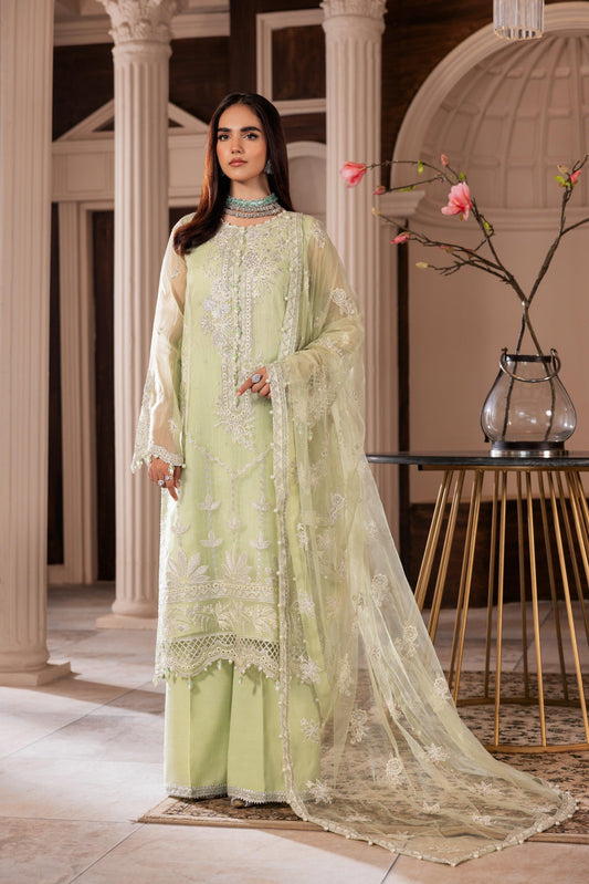 Woman in embroidered pastel green formal dress with dupatta from LA ELISE, elegant setting