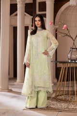 Woman in light green embroidered formal dress at LA ELISE, elegant fashion collection