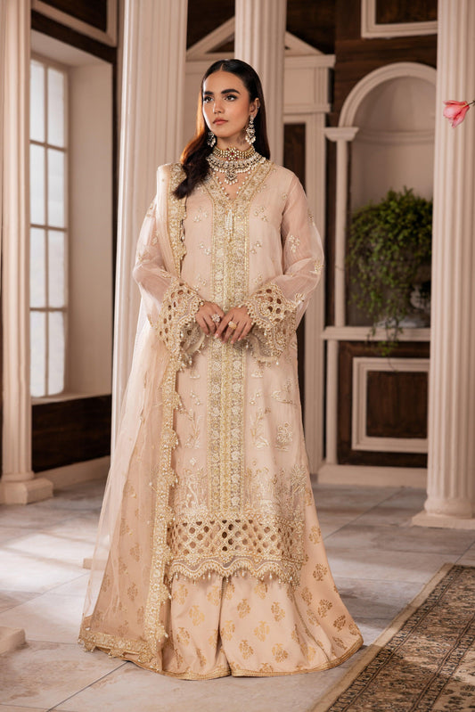 Woman in elegant embroidered beige formal dress from LA ELISE, indoor classic setting