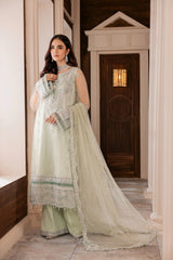 Woman modeling mint green embroidered formal dress with dupatta at LA ELISE fashion store