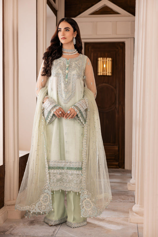 Woman wearing pastel green embroidered formal suit with sheer dupatta by LA ELISE