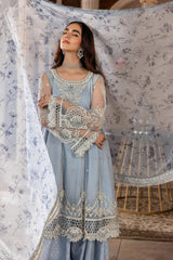 Woman wearing light blue embroidered unstitched formal dress from LA ELISE collection