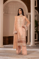 Woman wearing peach embroidered formal suit with dupatta from LA ELISE, elegant indoor setting