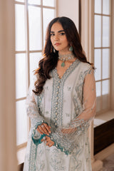 Woman in light blue embroidered formal dress with jewelry, LA ELISE women’s fashion