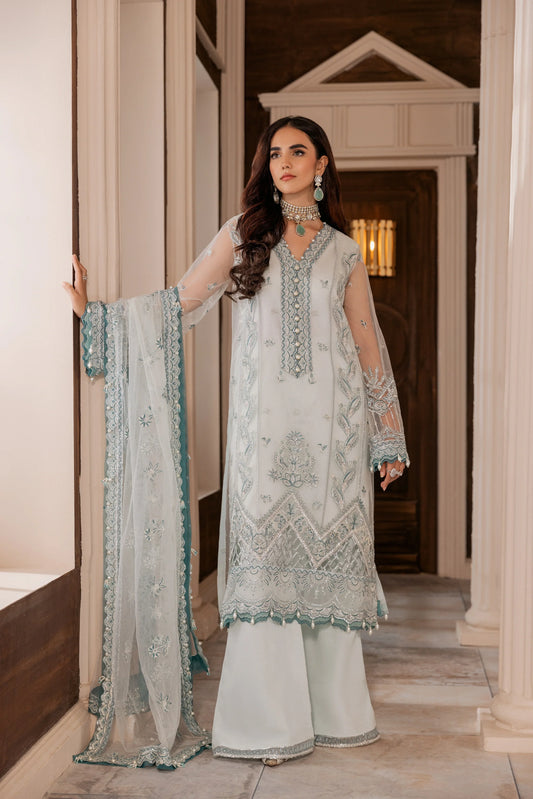 Woman in elegant light blue embroidered unstitched formal outfit from LA ELISE women's fashion.