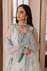 Woman wearing elegant embroidered formal dress with jewelry, LA ELISE women's fashion