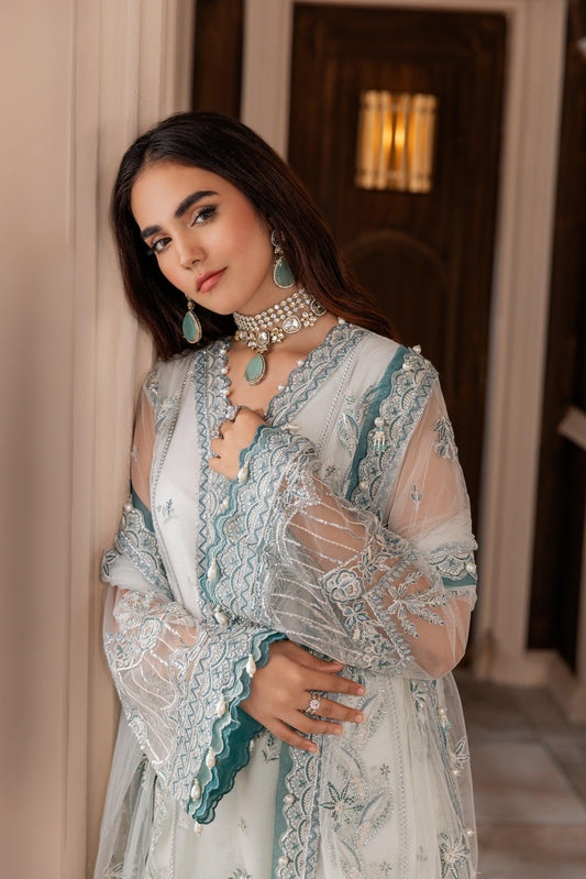 Woman in elegant embroidered pastel blue formal dress with jewelry, LA ELISE women’s fashion