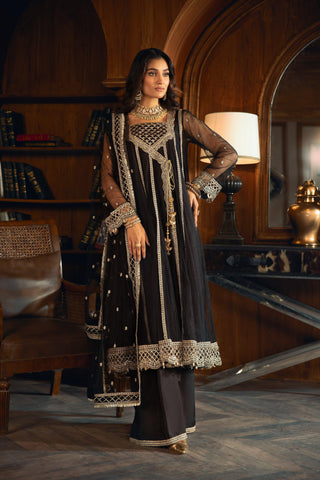Woman in black embroidered formal dress with dupatta at LA ELISE, indoor luxury setting