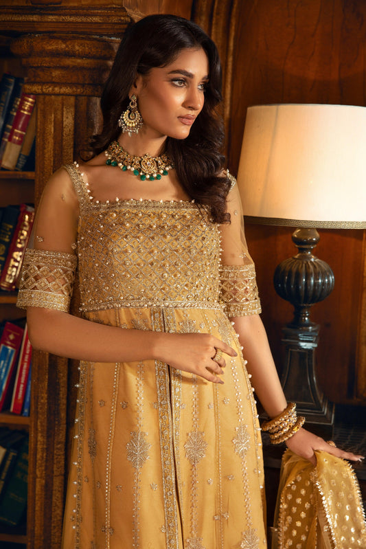 Woman in gold embroidered formal dress with jewelry, LA ELISE women’s fashion