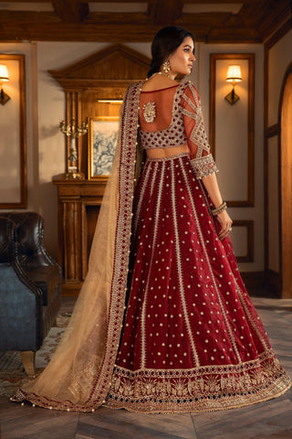 Woman in maroon embroidered formal lehenga with gold dupatta, LA ELISE luxury fashion