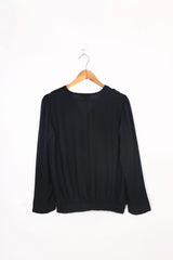 Black long sleeve women's top on wooden hanger, LA ELISE ready-to-wear fashion