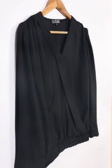 LA ELISE women's black V-neck blouse with long sleeves, displayed on a hanger.